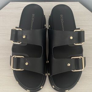 BCBGeneration Black Sandals with Gold Buckles